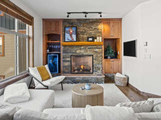 Experience luxury living in this stunning property featuring a cozy fireplace, perfect for chilly evenings.