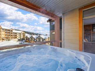 Enjoy the ultimate relaxation in this luxurious property featuring a private hot tub with stunning mountain views.