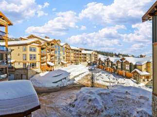 Discover luxury living in this stunning mountain property, featuring spacious units with balconies and breathtaking views.