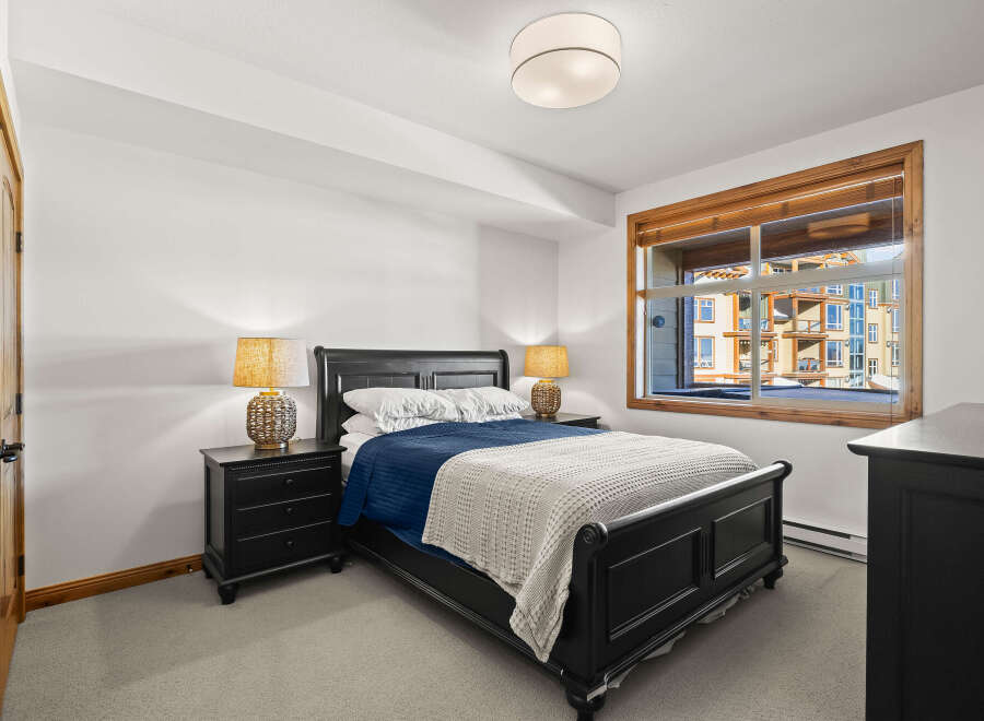 This stunning bedroom features a comfortable bed with a stylish design, perfect for relaxation.