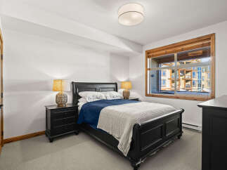 This stunning bedroom features a comfortable bed with a stylish design, perfect for relaxation.