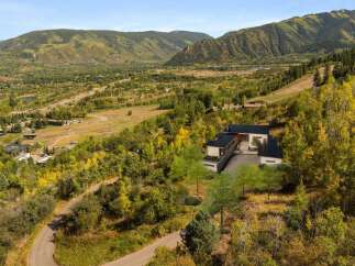 Nestled in a picturesque mountain landscape, this stunning property offers unparalleled views and luxurious living.