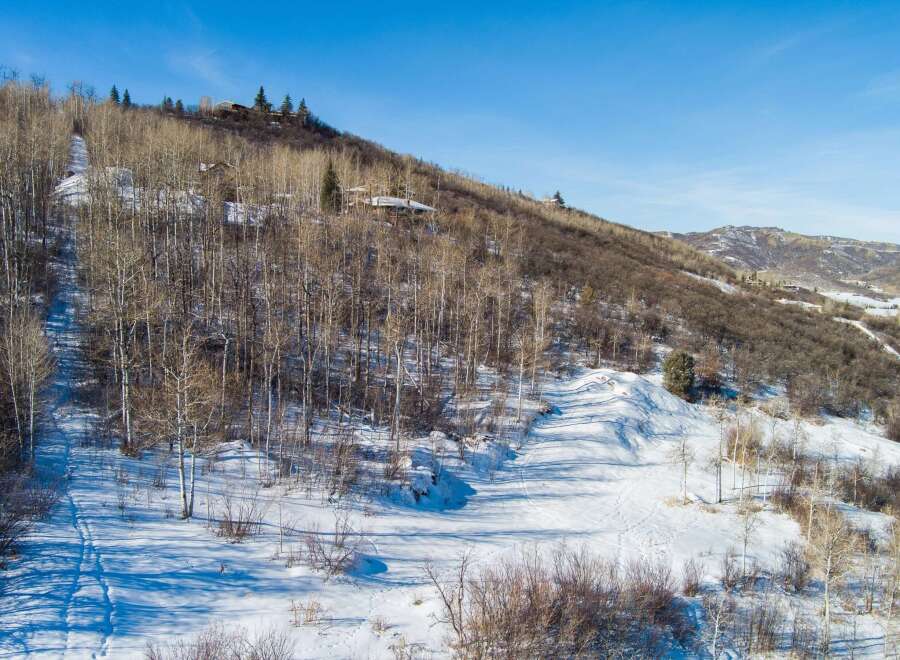 Nestled in a serene mountain landscape, this property offers a unique blend of natural beauty and modern living.