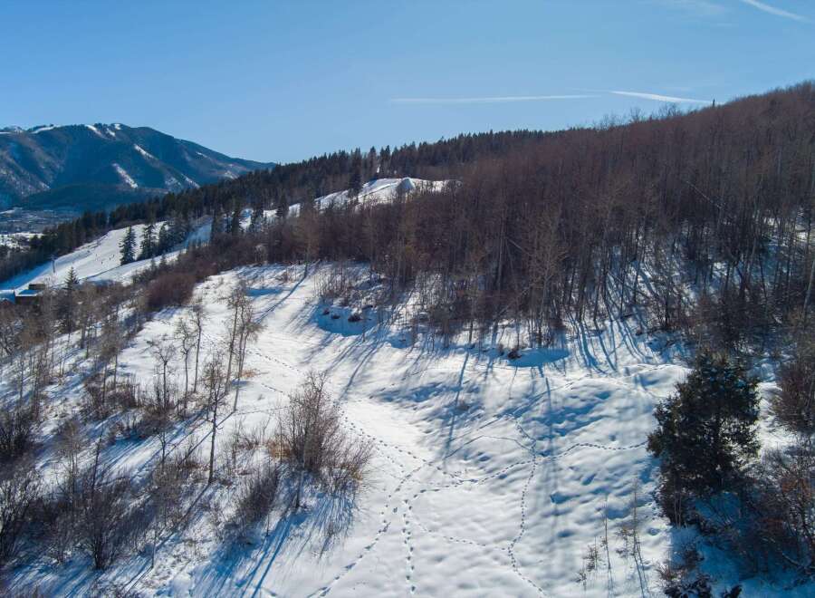 Explore the beauty of this stunning mountain property, perfect for those seeking a winter wonderland escape.