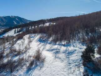 Explore the beauty of this stunning mountain property, perfect for those seeking a winter wonderland escape.