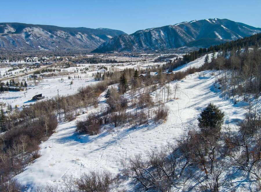 This stunning property offers breathtaking mountain views and is perfect for those seeking a winter wonderland escape.