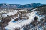 This stunning property offers breathtaking mountain views and is perfect for those seeking a winter wonderland escape.