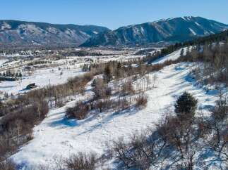 This stunning property offers breathtaking mountain views and is perfect for those seeking a winter wonderland escape.