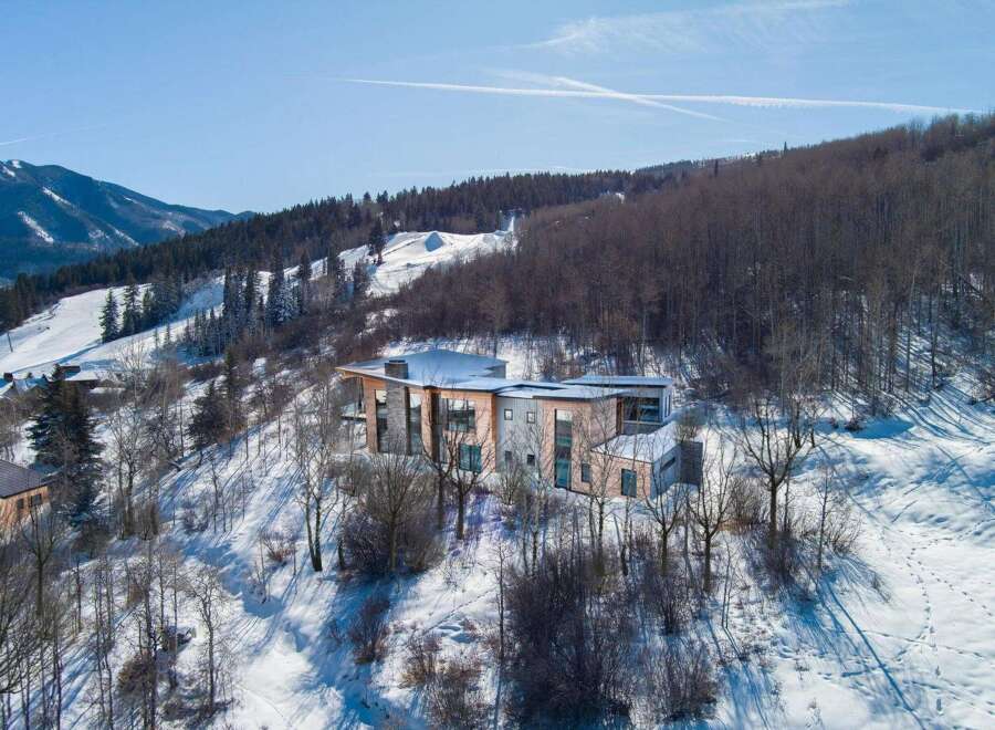 This stunning modern home is nestled in a picturesque mountain setting, offering breathtaking views and unparalleled privacy.