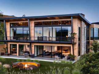 This stunning modern home boasts a sleek design with expansive windows that offer breathtaking views.