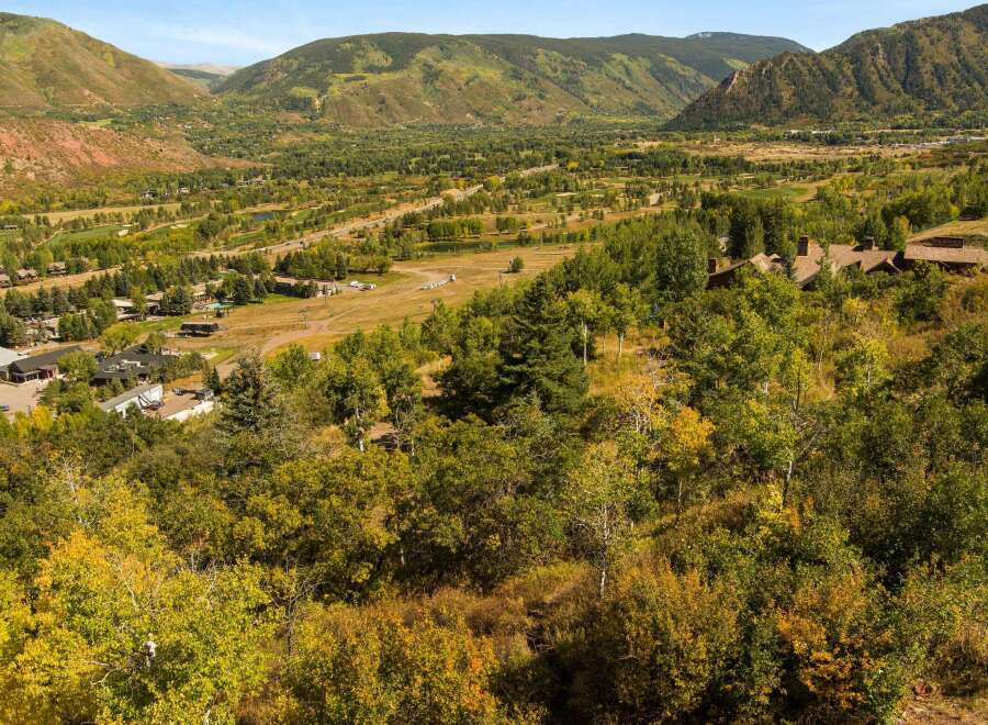 Nestled in a picturesque valley, this property offers stunning views of the surrounding mountains and lush greenery.