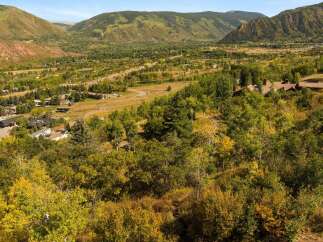 Nestled in a picturesque valley, this property offers stunning views of the surrounding mountains and lush greenery.