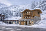 Experience the charm of this stunning mountain chalet, perfectly nestled in a snowy landscape.