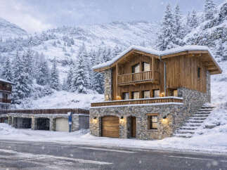 Experience the charm of this stunning mountain chalet, perfectly nestled in a snowy landscape.