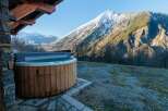 Enjoy breathtaking mountain views from this luxurious property featuring a private hot tub.