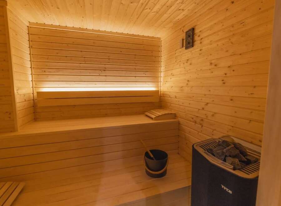 Step into relaxation with this stunning sauna.