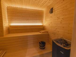 Step into relaxation with this stunning sauna.