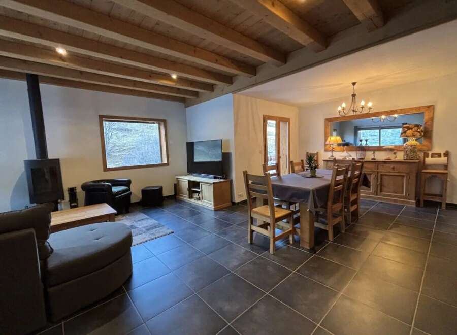 Step into this inviting living space, featuring a cozy fireplace and a stylish entertainment area.