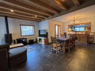 Step into this inviting living space, featuring a cozy fireplace and a stylish entertainment area.
