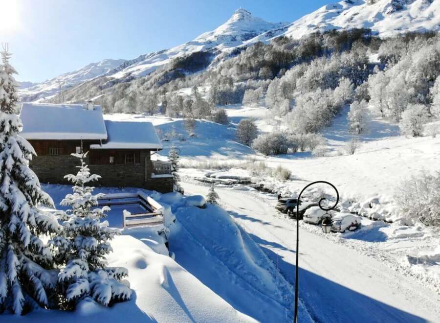 Escape to a winter wonderland with this charming chalet nestled in the heart of the mountains.