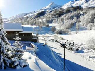 Escape to a winter wonderland with this charming chalet nestled in the heart of the mountains.