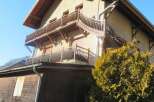 Discover the charm of this stunning property, featuring a beautifully designed balcony and a warm, inviting facade.
