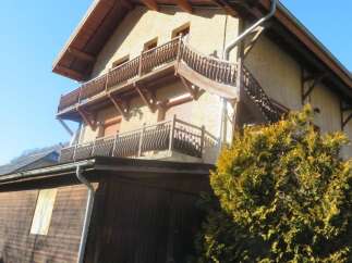 Discover the charm of this stunning property, featuring a beautifully designed balcony and a warm, inviting facade.