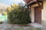Discover this charming property featuring a beautiful wooden balcony and a rustic wooden door.