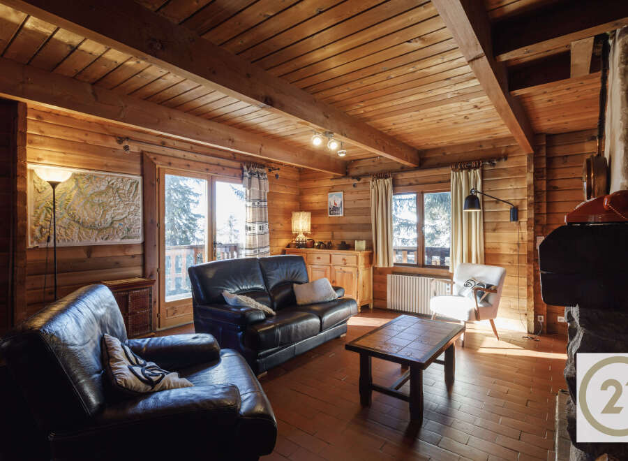 This cozy cabin boasts a warm and inviting atmosphere with its wooden interior and charming details.