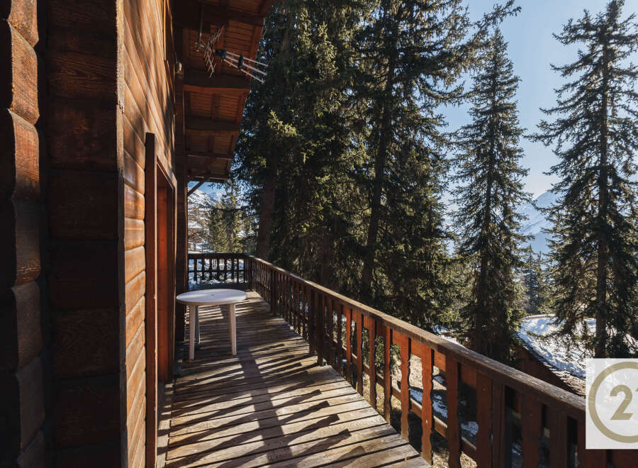 Enjoy breathtaking mountain views from this charming balcony.