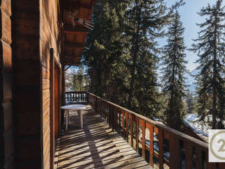 Enjoy breathtaking mountain views from this charming balcony.