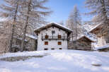 Discover the charm of this stunning winter chalet nestled in a picturesque snow-covered landscape.
