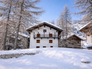 Discover the charm of this stunning winter chalet nestled in a picturesque snow-covered landscape.