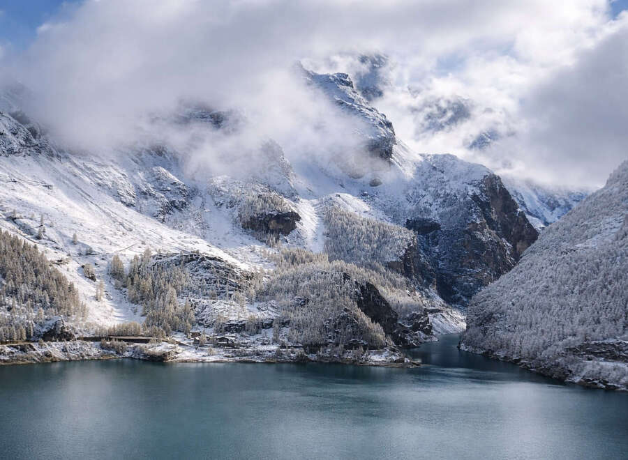Discover breathtaking mountain views and serene lakefront living in this stunning property.