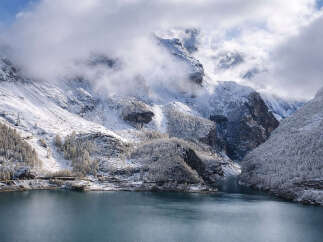 Discover breathtaking mountain views and serene lakefront living in this stunning property.