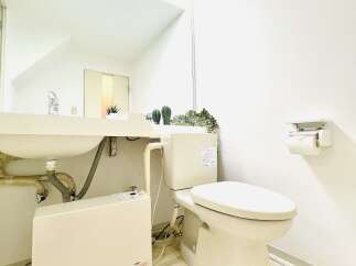 This modern bathroom features a sleek design with a clean, white aesthetic.