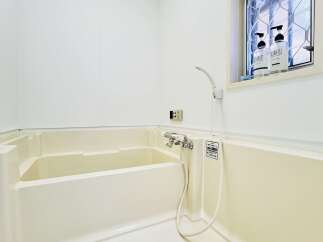 This pristine bathroom offers a clean and modern aesthetic, perfect for relaxation.