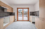 This stunning kitchen boasts modern design and breathtaking mountain views.
