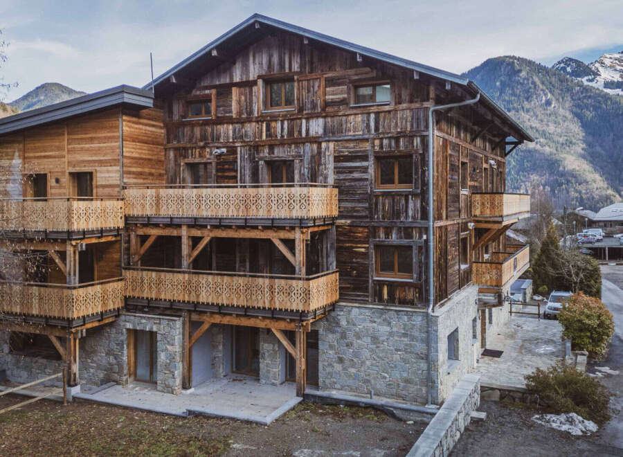 Discover the charm of this stunning wooden chalet nestled in a picturesque mountain setting.