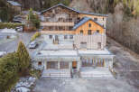 Discover the charm of this stunning property, boasting a unique blend of stone and wood architecture.