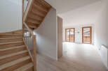 This stunning property boasts a beautiful wooden staircase, adding a touch of elegance to the interior.