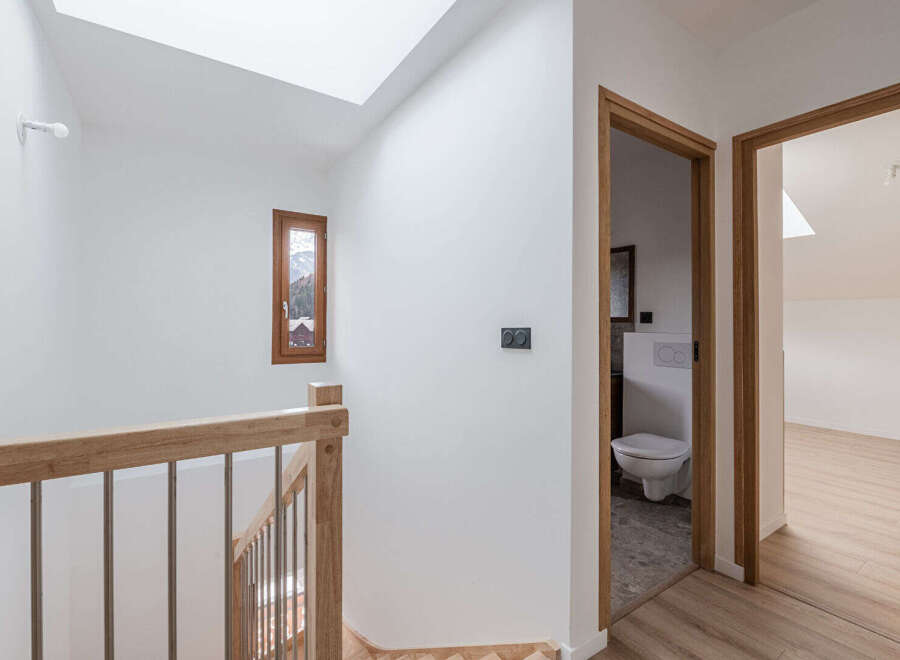 This stunning property features a bright and airy hallway with a modern design.