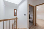 This stunning property features a bright and airy hallway with a modern design.