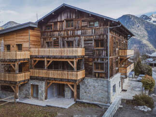 Discover the charm of this stunning wooden chalet nestled in a picturesque mountain setting.