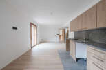 This modern kitchen boasts sleek cabinetry and a stylish sink, perfect for culinary enthusiasts.