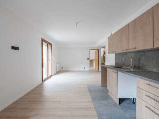 This modern kitchen boasts sleek cabinetry and a stylish sink, perfect for culinary enthusiasts.