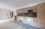 Discover this modern kitchen with sleek cabinetry and a contemporary design.