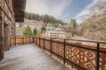 Enjoy breathtaking mountain views from this charming balcony.