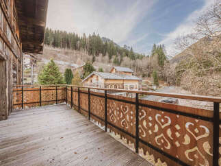 Enjoy breathtaking mountain views from this charming balcony.