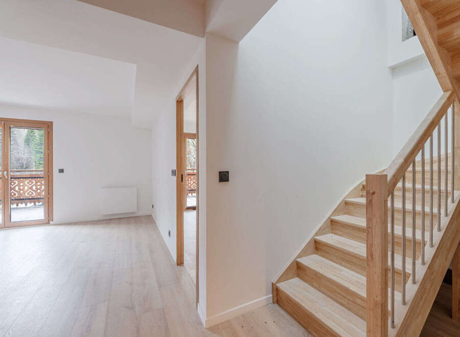 This stunning property boasts a bright and airy interior with a modern staircase.